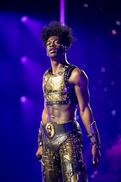 Lil Nas X wearing a concert outfit designed by Disco Daddy and Coach.