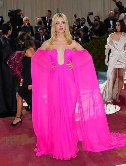 Nicola Peltz Style Evolution: her pink, draped gown from The 2022 Met Gala on May 02, 2022 in New Yo...