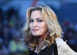 US singer-songwriter Madonna poses arriving on the carpet to attend a special screening of the film ...