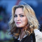 US singer-songwriter Madonna poses arriving on the carpet to attend a special screening of the film ...