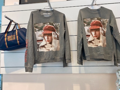 The Taylor Swift merch at the exhibit in NYC includes official album merchandise. 